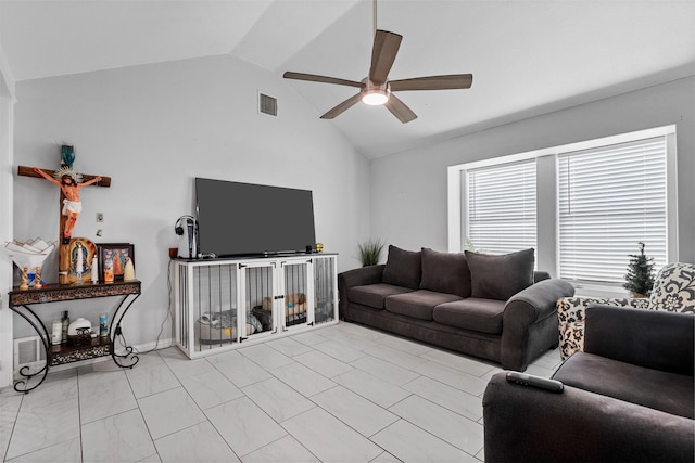 living room with ceiling fan and vaulted ceiling