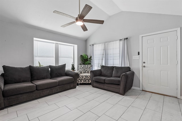 living room featuring ceiling fan, lofted ceiling, and light tile patterned floors