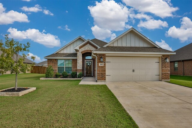 view of front facade with a garage and a front yard