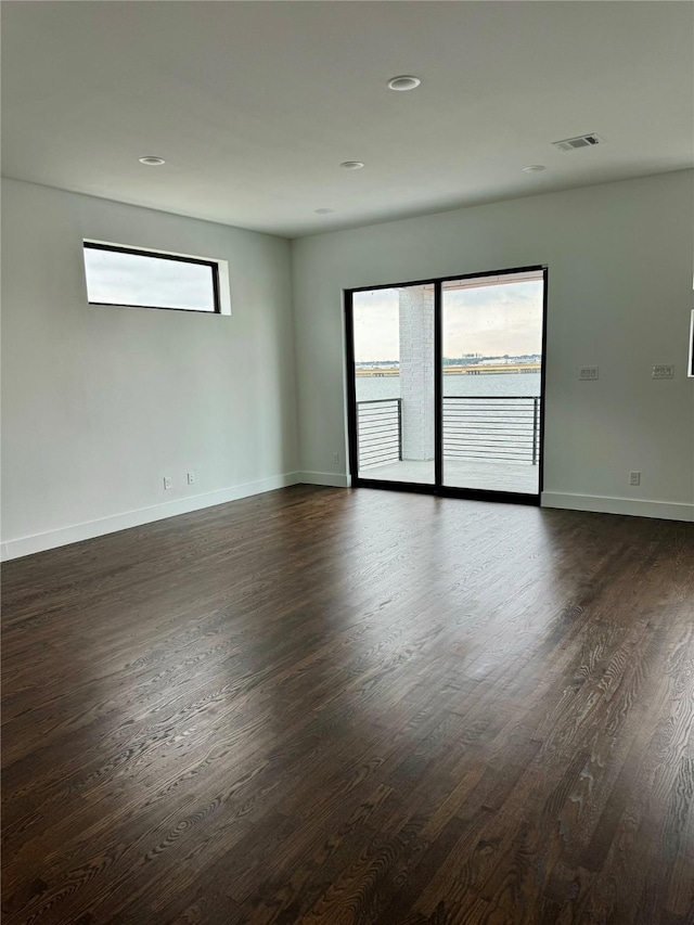 empty room featuring dark wood-type flooring