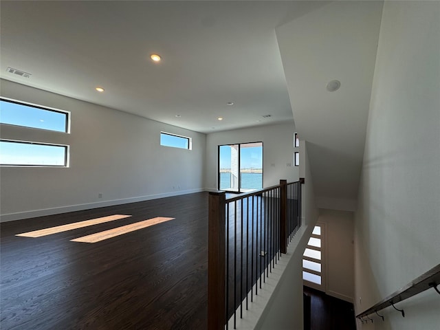 spare room with dark hardwood / wood-style flooring