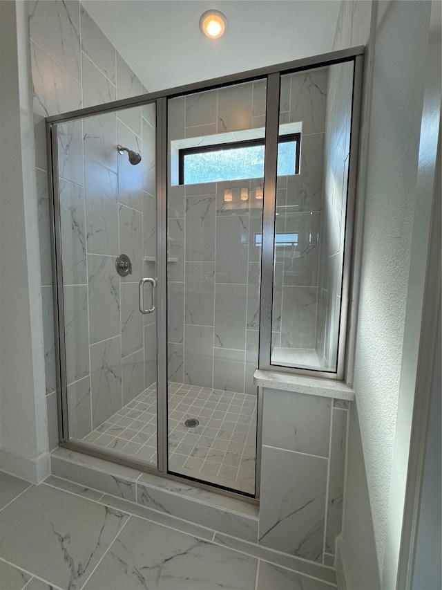 bathroom with an enclosed shower