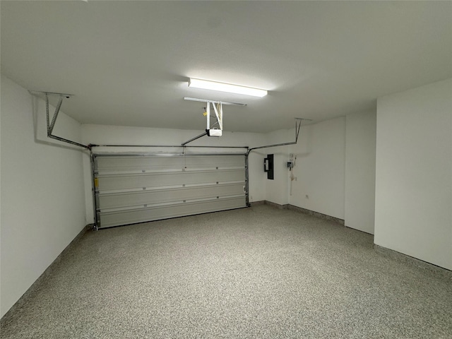 garage featuring a garage door opener and electric panel