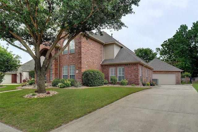 view of front of home with a garage, central air condition unit, and a front lawn