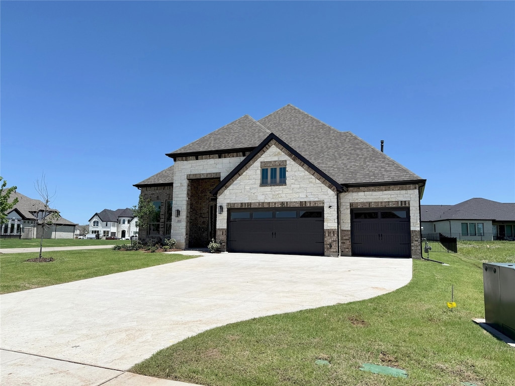 203 Links Ct, Heath, TX 75032 - french country style house with a shingled roof, a front lawn, driveway, stone siding, and a garage