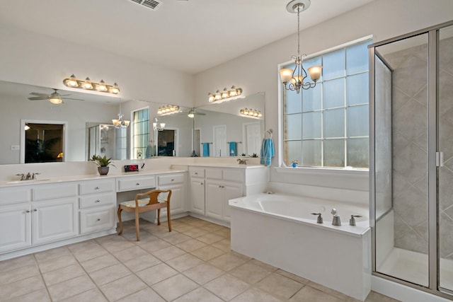 bathroom featuring tile patterned floors, ceiling fan, vanity, and plus walk in shower