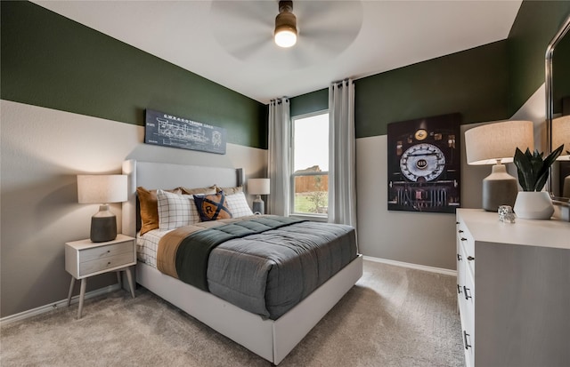 bedroom featuring light carpet and ceiling fan