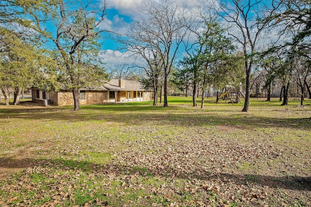 view of yard featuring a playground