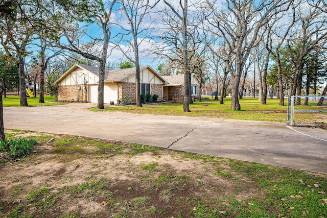 view of front of house with a front yard and a garage