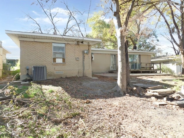 rear view of house with cooling unit