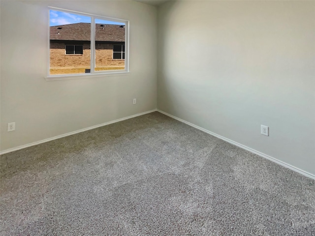 spare room featuring carpet floors