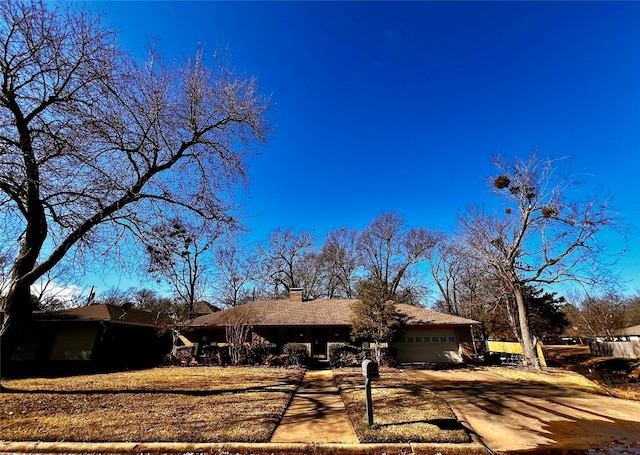 single story home featuring a garage