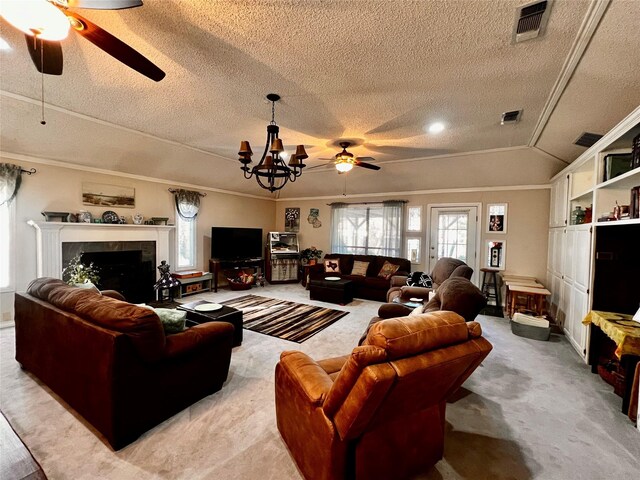 1030 Laurel Ln, Paris, TX 75460 - living room with light colored carpet, a textured ceiling, ceiling fan with notable chandelier, and a tiled fireplace