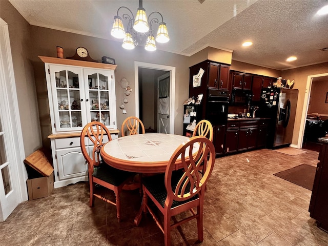 1030 Laurel Ln, Paris, TX 75460 - dining area with a textured ceiling and a chandelier