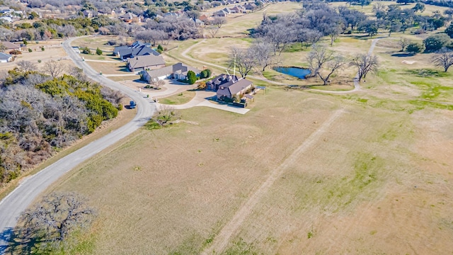 birds eye view of property with a rural view