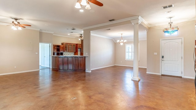 unfurnished living room featuring ornate columns, a chandelier, and ornamental molding