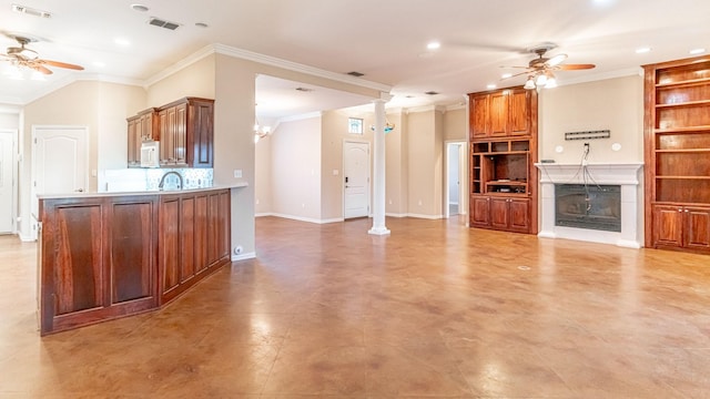 kitchen featuring kitchen peninsula, decorative backsplash, ceiling fan, and ornamental molding