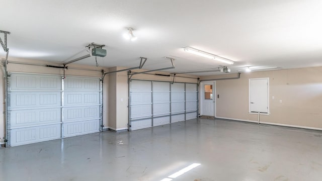 garage featuring a garage door opener