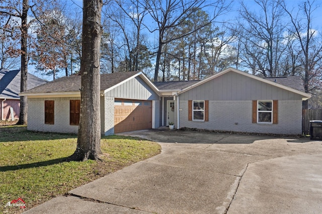 ranch-style house with a front yard and a garage