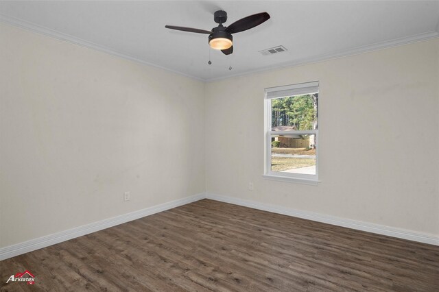 spare room with dark hardwood / wood-style floors, ceiling fan, and ornamental molding