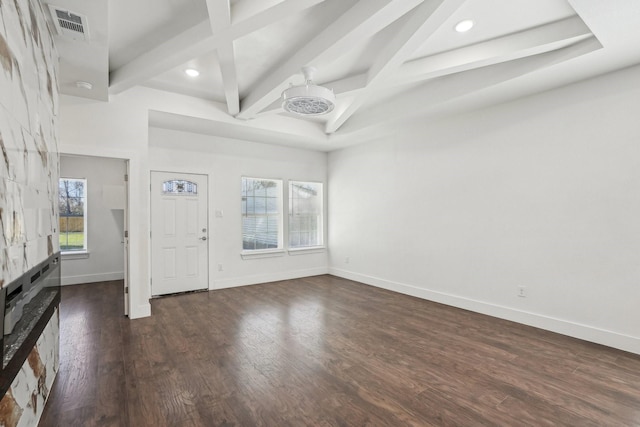 foyer entrance featuring beamed ceiling, coffered ceiling, and dark hardwood / wood-style flooring