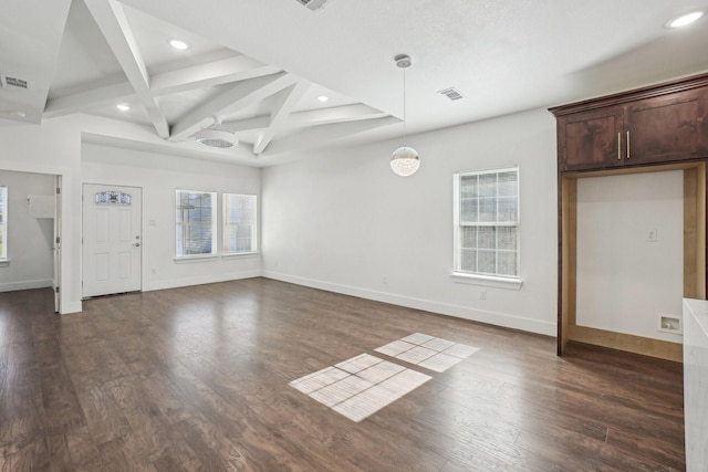 unfurnished living room with coffered ceiling, dark hardwood / wood-style floors, and beam ceiling