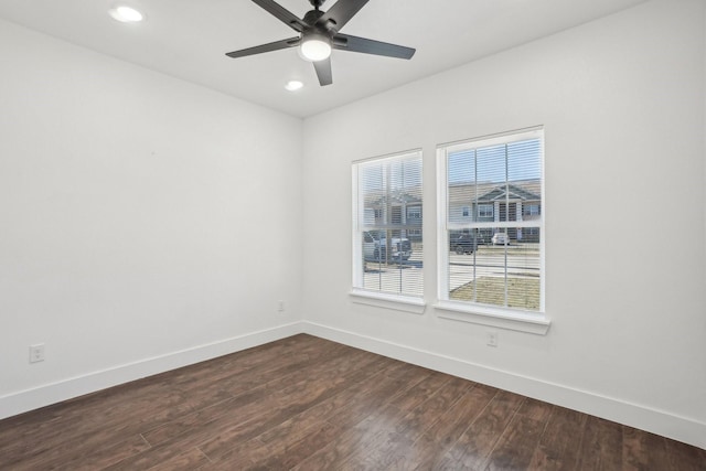 unfurnished room with dark hardwood / wood-style floors and ceiling fan