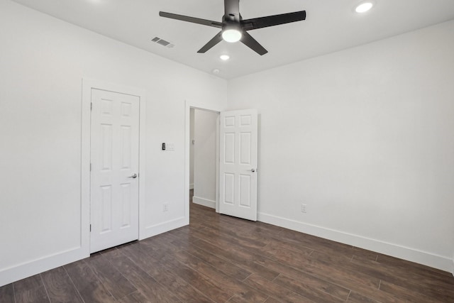 unfurnished bedroom with dark wood-type flooring and ceiling fan