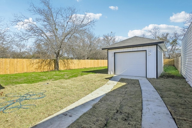 garage featuring a yard