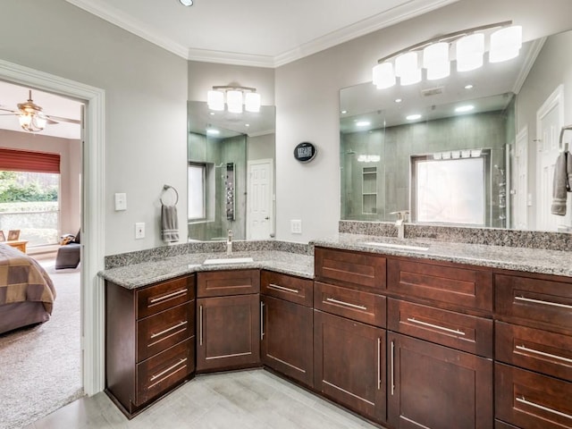 bathroom with ceiling fan, crown molding, and vanity