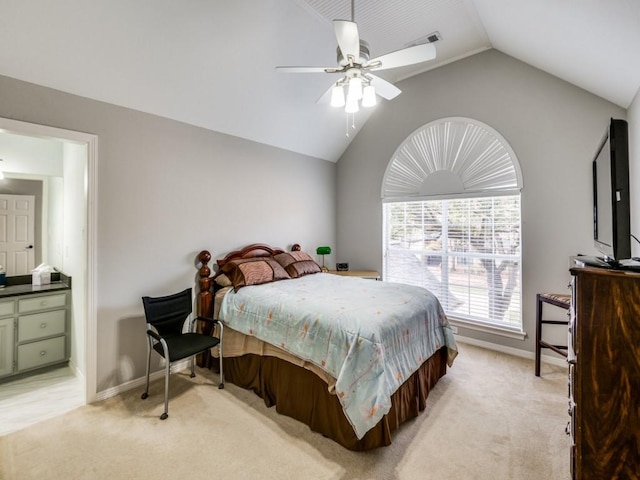 bedroom with vaulted ceiling, light carpet, and ceiling fan