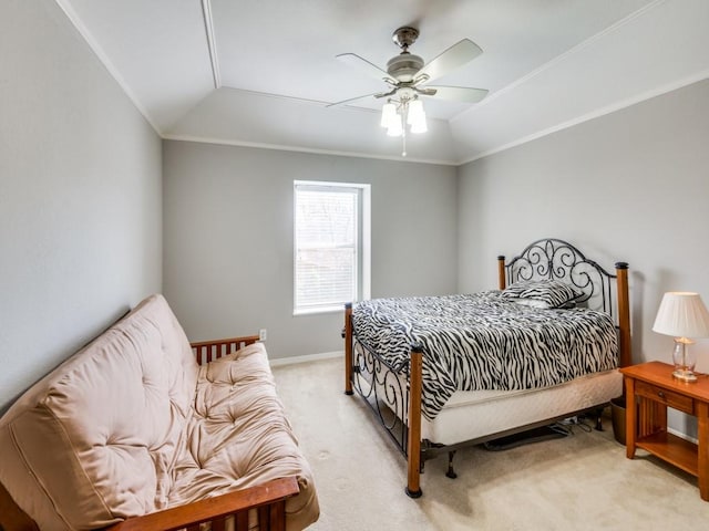 carpeted bedroom featuring crown molding, vaulted ceiling, and ceiling fan