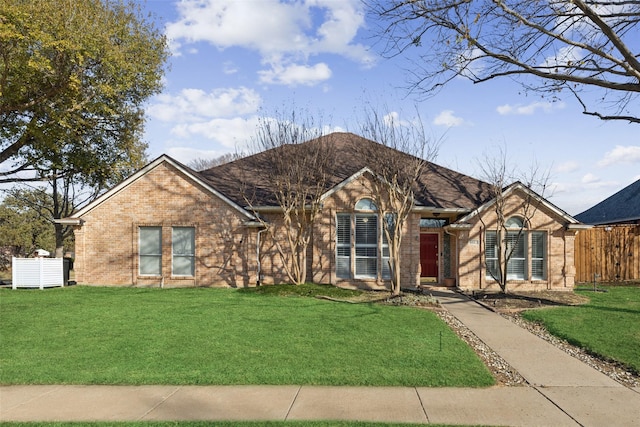 ranch-style house featuring a front lawn