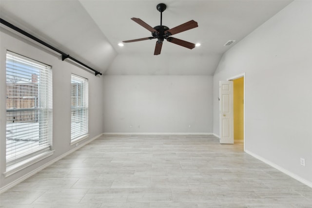 empty room featuring ceiling fan and lofted ceiling