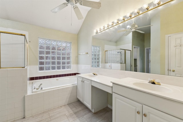 bathroom featuring vaulted ceiling, vanity, tile patterned flooring, and independent shower and bath