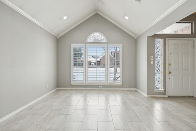 foyer entrance featuring vaulted ceiling and crown molding