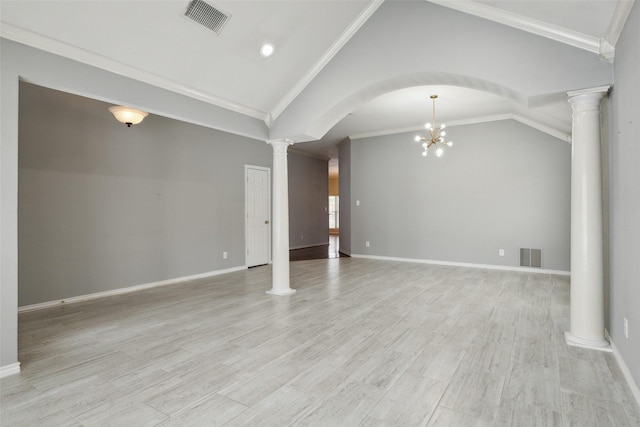 unfurnished living room with light hardwood / wood-style flooring, a notable chandelier, lofted ceiling, decorative columns, and ornamental molding