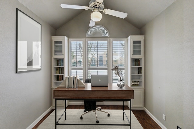 office with lofted ceiling, dark hardwood / wood-style flooring, ceiling fan, and plenty of natural light