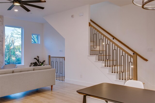 living room featuring ceiling fan and light wood-type flooring