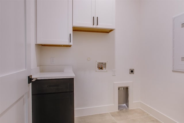 laundry room with washer hookup, cabinets, hookup for an electric dryer, gas dryer hookup, and light tile patterned flooring