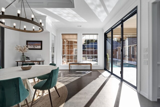 dining room with hardwood / wood-style floors, lofted ceiling, a wealth of natural light, and ornamental molding