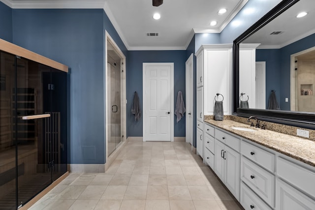 bathroom with tile patterned floors, vanity, an enclosed shower, and ornamental molding