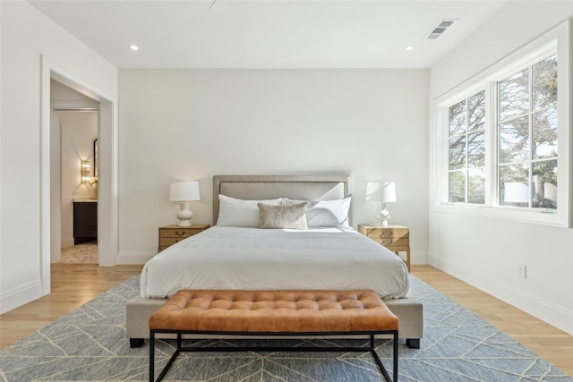 bedroom with light wood-type flooring