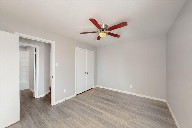 544 Blanco Dr, Mesquite, TX 75150 - unfurnished bedroom with ceiling fan, hardwood / wood-style floors, and a closet