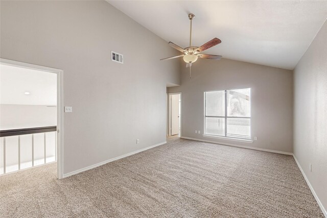 spare room with light carpet, ceiling fan, and high vaulted ceiling