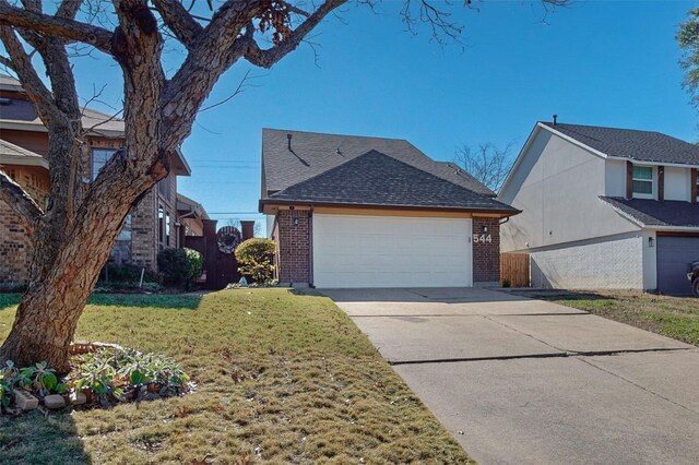 view of home's exterior with a garage and a yard