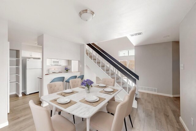 dining room featuring light wood-type flooring