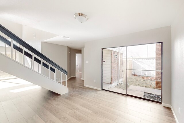 spare room featuring light hardwood / wood-style floors