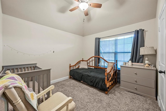 carpeted bedroom featuring ceiling fan and vaulted ceiling