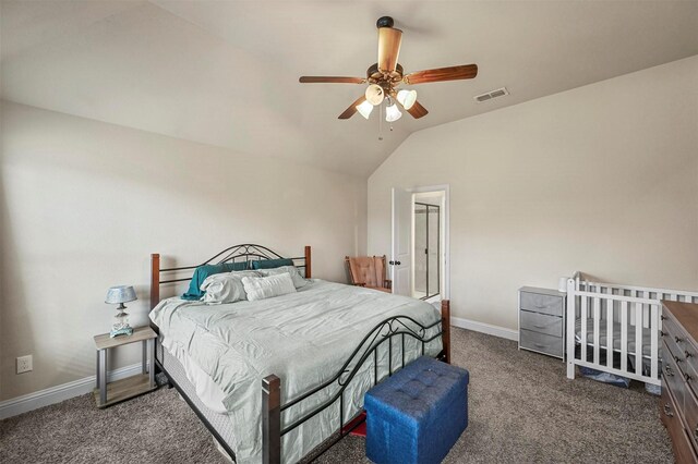 bedroom with ceiling fan, carpet floors, and vaulted ceiling